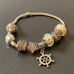 Pandora Charm bracelet with 8 Charms Bring Offers